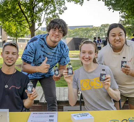 Michigan college ministry welcomes freshmen to campus by passing out holy water